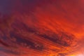 Huge orange cloud in the sky at sunset