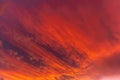 Huge orange cloud in the sky at sunset