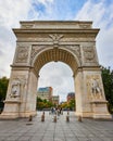 Huge panorama of Washington Square Park arch in New York City with tourists in background