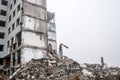 A huge pile of gray concrete debris from piles and stones of the destroyed building. Copy space Royalty Free Stock Photo