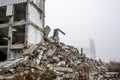 A huge pile of gray concrete debris from piles and stones of the destroyed building. Copy space Royalty Free Stock Photo