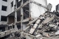 A huge pile of gray concrete debris from piles and stones of the destroyed building. The impact of the destruction Royalty Free Stock Photo