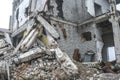 A huge pile of gray concrete debris from piles and stones of the destroyed building. The impact of the destruction Royalty Free Stock Photo