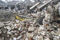 A huge pile of gray concrete debris from piles and stones of the destroyed building. The impact of the destruction Royalty Free Stock Photo