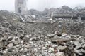 A huge pile of gray concrete debris from piles and stones of the destroyed building. The impact of the destruction Royalty Free Stock Photo