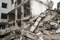 A huge pile of gray concrete debris from piles and stones of the destroyed building. The impact of the destruction Royalty Free Stock Photo
