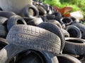 Huge piles from old car tires under a bridge in Varna, Bulgaria. Pollution all around.