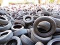 Huge piles from old car tires under a bridge in Varna, Bulgaria. Pollution all around. Royalty Free Stock Photo