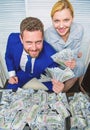 Huge profit concept. Financial success. Man businessman and woman secretary with pile dollar banknotes. Profit and