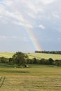 rainbow in the Eifel sky coming straight out of a forest Royalty Free Stock Photo