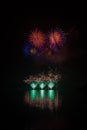 Huge, rich and colorful fireworks over surface of Brno`s Dam with reflection on the surface of lake Royalty Free Stock Photo