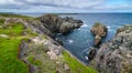 Huge rocks and boulder outcrops along Cape Bonavista coastline in Newfoundland, Canada. Royalty Free Stock Photo