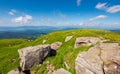 Huge rocks on the grassy mountain side Royalty Free Stock Photo