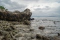 Huge rocks and small stones on the beach at the tropical island Royalty Free Stock Photo