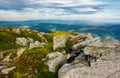 Huge rocky formations on the grassy hills