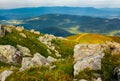 Huge rocky formations on the grassy hills Royalty Free Stock Photo