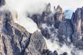 Huge rocky mountains view covered with clouds, Dolomites