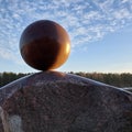 A huge round stone miraculously keeps balance