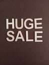 Huge sale sign on a brown background Royalty Free Stock Photo