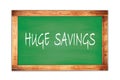 HUGE SAVINGS text written on green school board