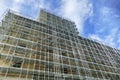 Huge scaffolding on a building facade for restoration Royalty Free Stock Photo