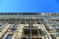 Huge scaffolding for restoration on ancient building facade Royalty Free Stock Photo