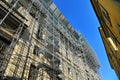 Huge scaffolding for restoration on ancient building facade Royalty Free Stock Photo