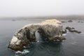 Aerial of Sea Stack and Natural Arch Off Coast of California Royalty Free Stock Photo