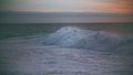 Huge sea wave foaming at morning skyline. Powerful surf rolling breaking shallow