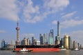 Huge ship is escorted through river in Shanghai