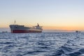 Huge ships at sea at sunset