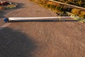 Huge size wind turbine blade on a platform ready for transportation in a yard. Aerial view. Heavy and long cargo movement.