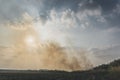 Huge smoke cloud of burning corn field.Burning corn field after the harvest Royalty Free Stock Photo