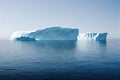 Huge snow iceberg in water on seascape.
