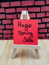Huge spring sale message on a wood easel Royalty Free Stock Photo