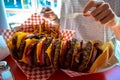 A huge stacked burger and fries