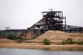 Huge stationary separator of sand and gravel on the shore of the reservoir