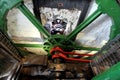 The huge steel flywheel of an industrial steam engine used at a