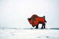 A huge steel monument to the Bison at the entrance to the Brest region in winter. Poor photography conditions.