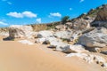 Huge stone boulders on the mountainside. Hot yellow sand