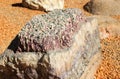 A huge stone with magical beautiful pink and white quartz