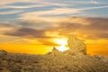 Huge stone in a prairie on a sunset background