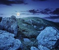 Huge stones in valley on top of mountain range at night Royalty Free Stock Photo