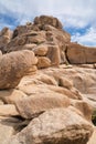 Huge sunlit rocks forming mountain in the scenic Joshua Tree National Park Royalty Free Stock Photo