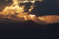 Huge sunset sun against a tiny temple high above, near Inle Lake, Burma