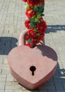 Huge symbolic padlock in the shape of a heart on the stone square. eternal love and symbolic ideas of romance