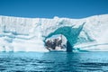 Beautiful arch shaped iceberg in Antarctica. Royalty Free Stock Photo