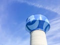 Water tower in Carrollton, Texas against cloud blue sky