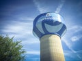 Water tower in Carrollton, Texas against cloud blue sky