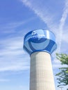 Water tower in Carrollton, Texas against cloud blue sky
